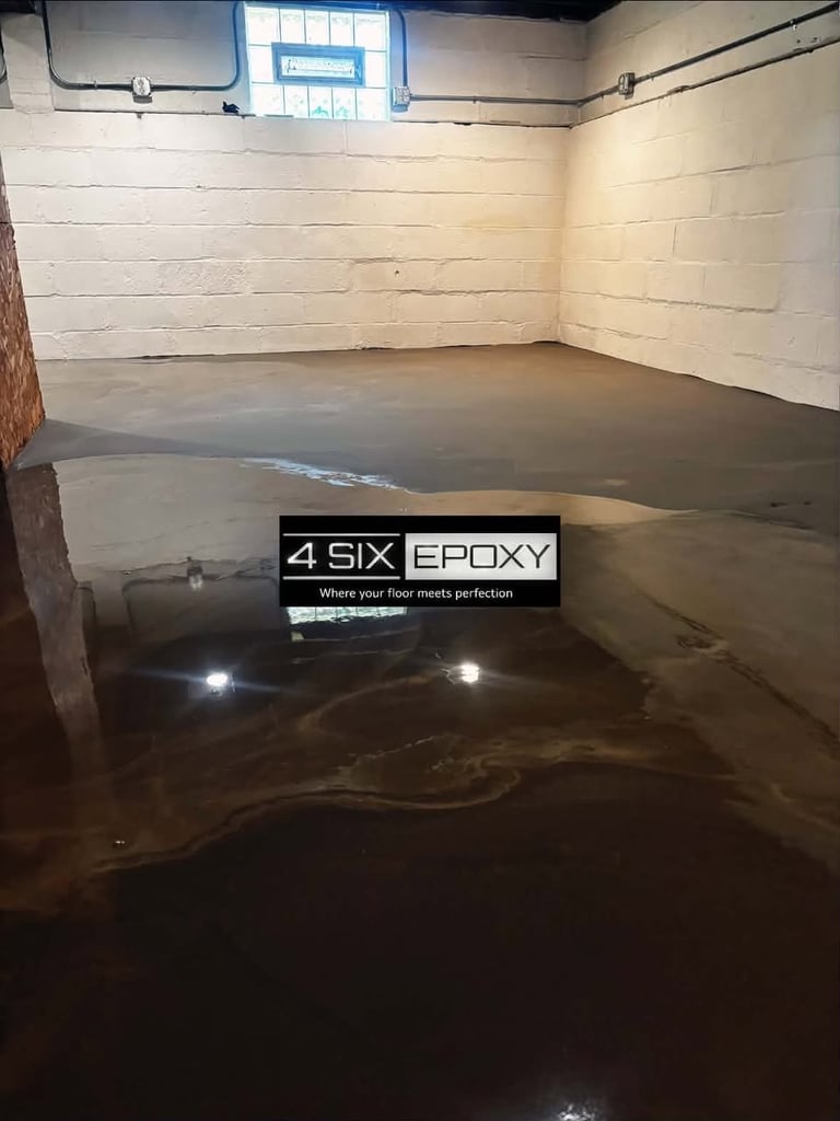 Empty garage interior with white brick walls, concrete floor, and 4 Six Epoxy branding sign