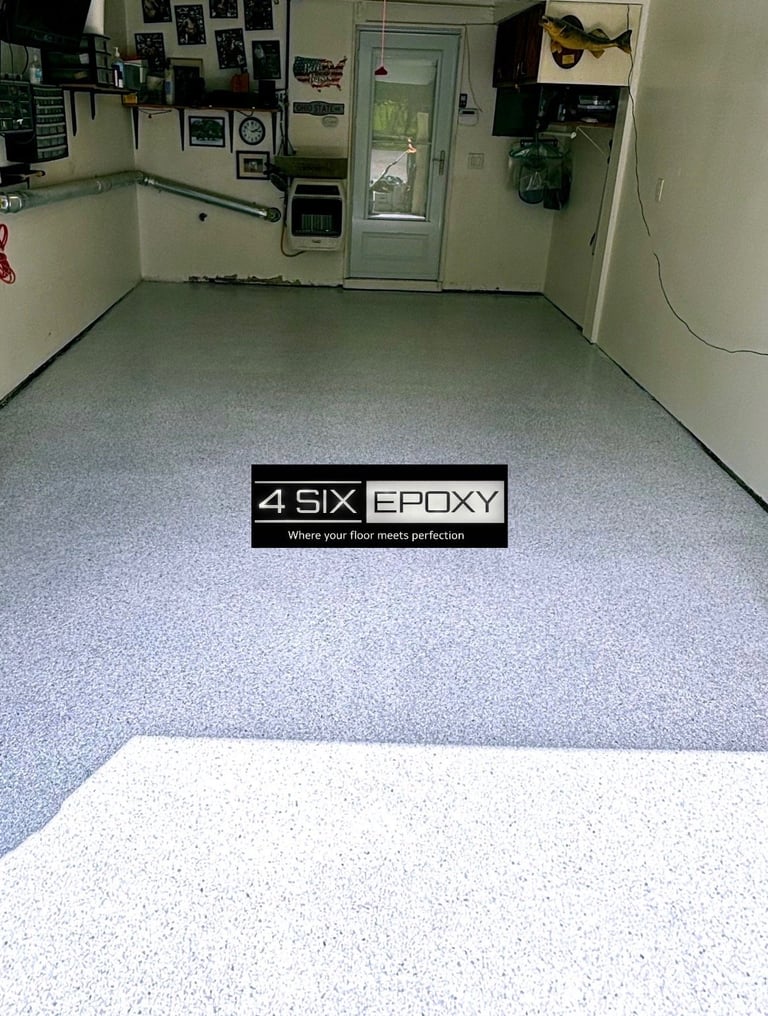 Garage interior with gray speckled epoxy floor